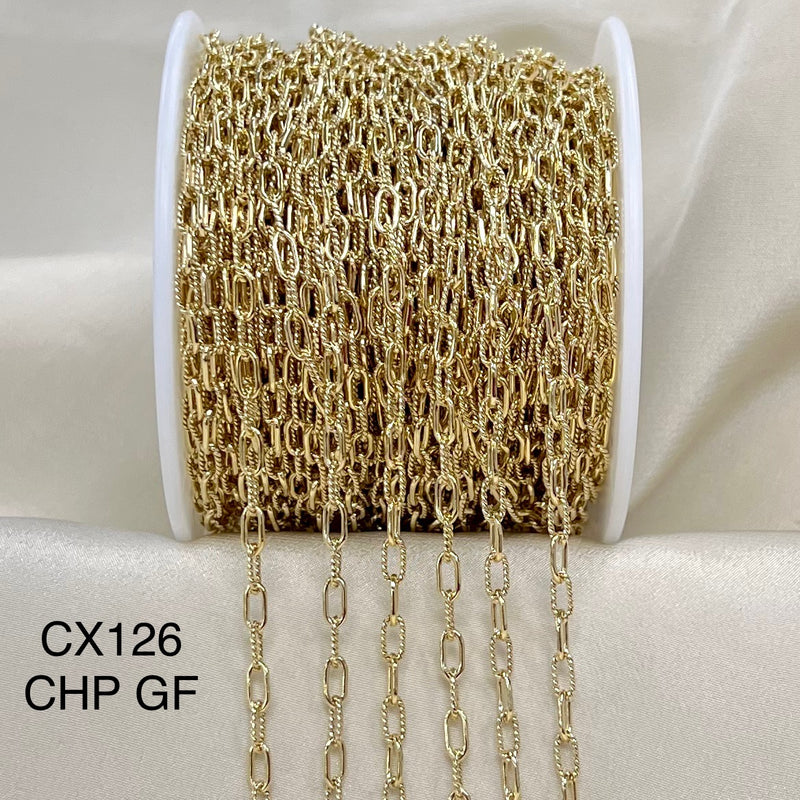 Gold chain on a spool with &