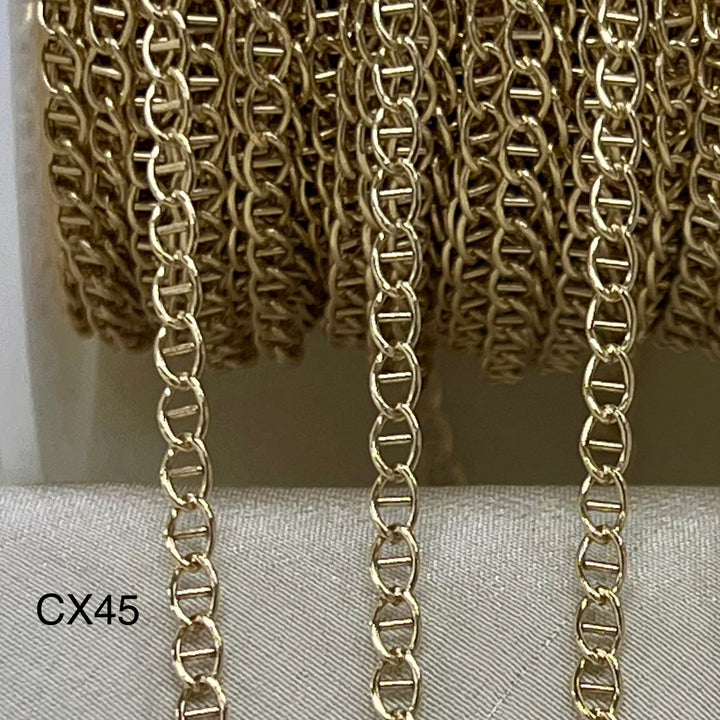 Gold Filled Mariner chain on a textured surface with &