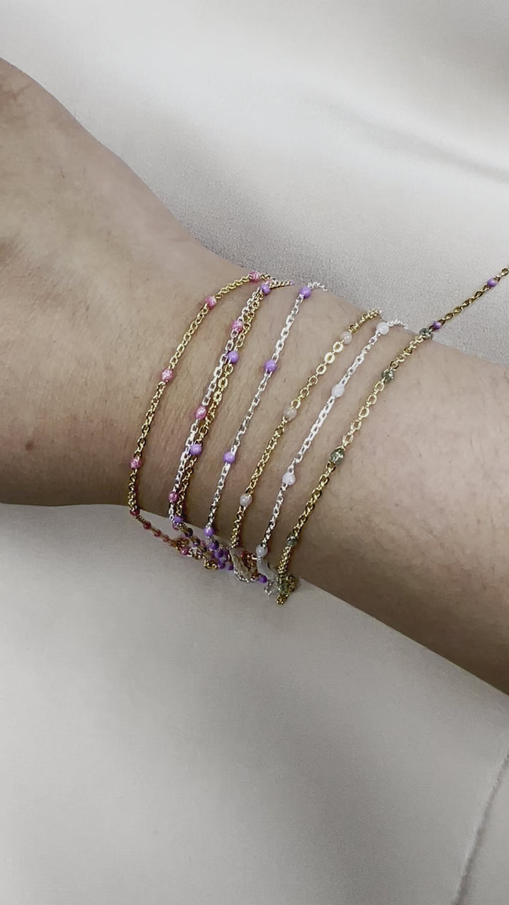 CX25: 15mm Space Transparent Enamel Satellite Chain by the foot (24GA Jump Ring)